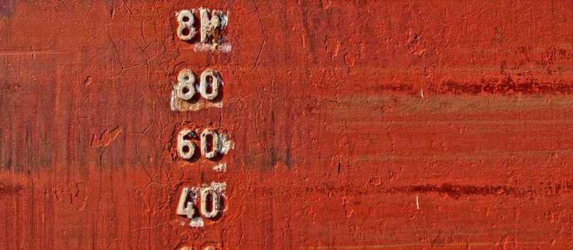Numbers on a red wall.